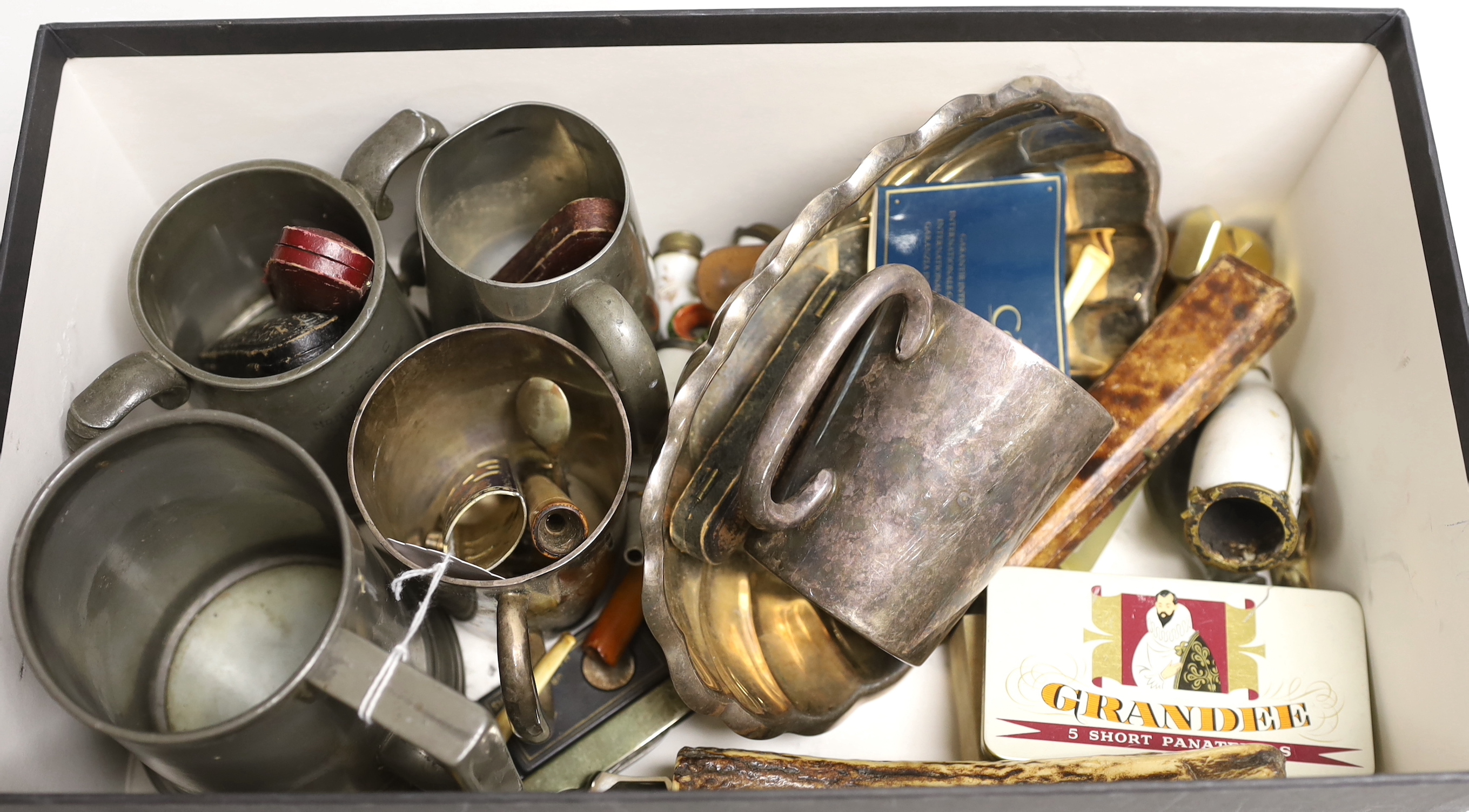 A group of assorted smoker's accoutrements and plated mugs